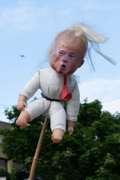 Photo of scary Donald Trump Doll with flyaway hair and paper red tie.Picture